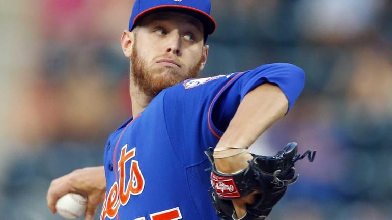 Zack Wheeler of the Mets delivers a pitch in the...