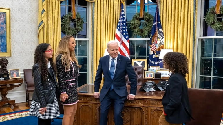 Mariah Carey, with twins Monroe and Moroccan, recently met President Joe...