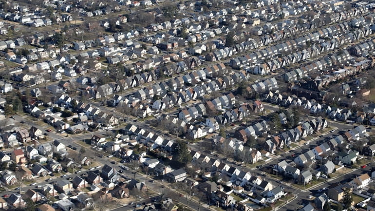 A neighborhood of houses over Nassau County is seen in...