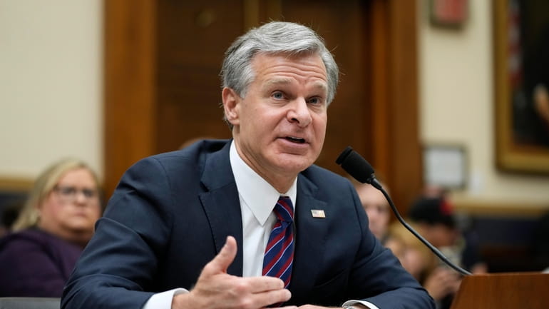 FBI Director Christopher Wray testifies before a House Committee on...