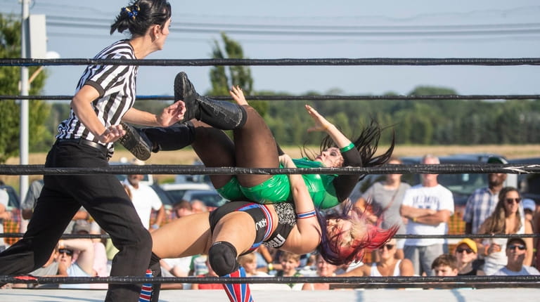 Natalia Markova faces off against Machiko San during LuchaRumble, a live wrestling...