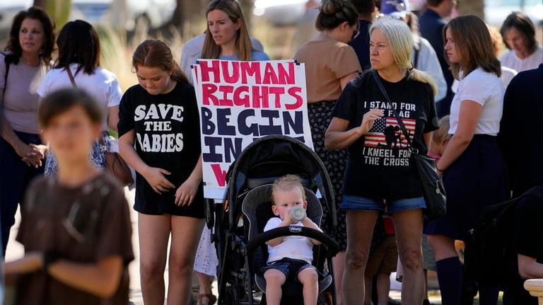 Anti-abortion supporters stand outside the Capitol, Wednesday, May 1, 2024,...