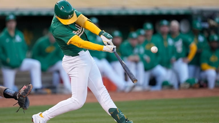 Oakland Athletics' Tyler Nevin hits an RBI single against the...