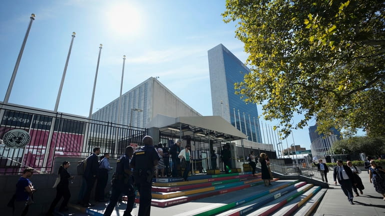People arrive at the headquarters of United Nations ahead of...