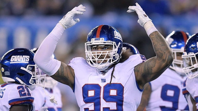 Giants defensive end Leonard Williams (99) motions after a play...
