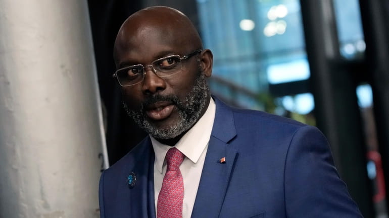 Liberia President George Weah arrives to attend the Paris Peace...