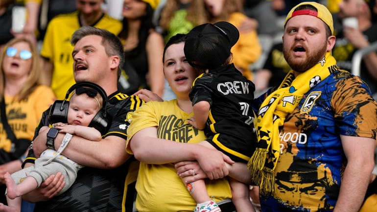 Columbus Crew fans sing prior to the team's MLS soccer...
