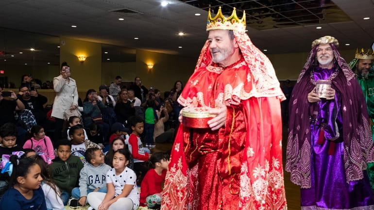 The three kings arrive to give toys to children during...