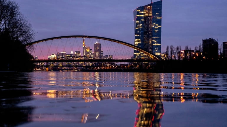 The European Central Bank is reflected in the river Main...
