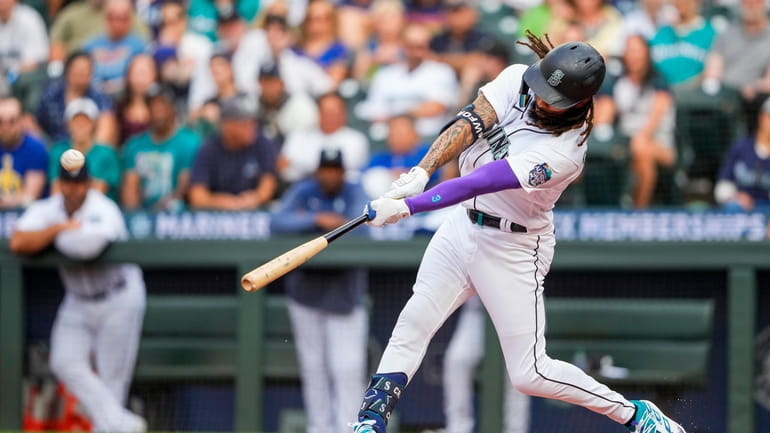 Seattle Mariners' J.P. Crawford hits a solo home run against...