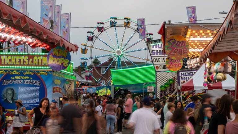 Rides and games at the Feast of St. Rocco at...