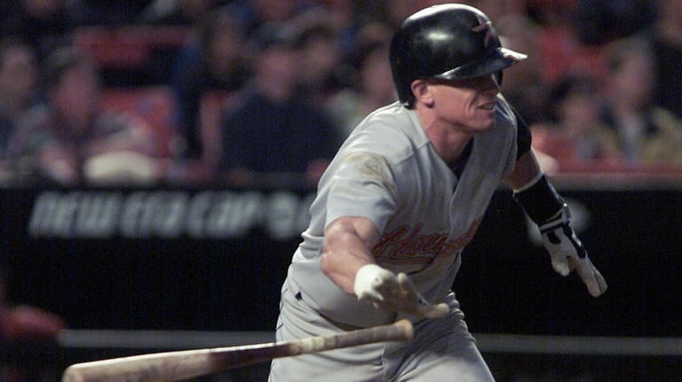 The Astros' Craig Biggio heads to first with a hit...