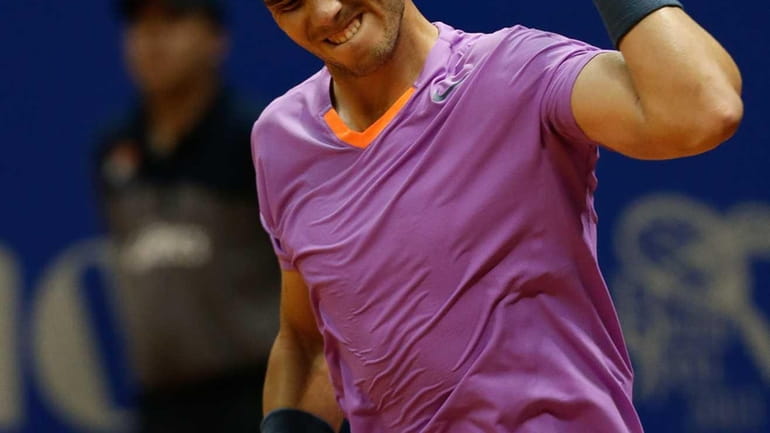 Rafael Nadal celebrates his victory over Argentinian David Nalbandian in...