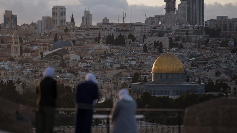 Muslim women visit the Mount of Olives, overlooking the Dome...
