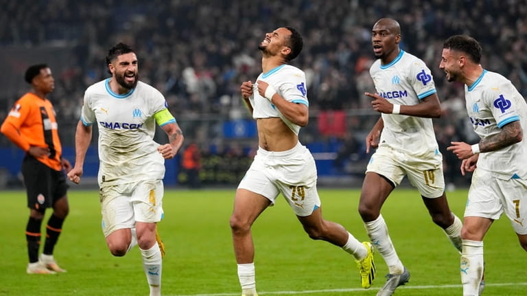 Marseille's Iliman Ndiaye, centre, celebrates after scoring his side second...