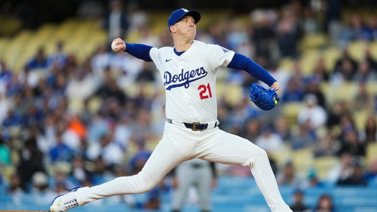 Los Angeles Dodgers starting pitcher Walker Buehler throws during the...