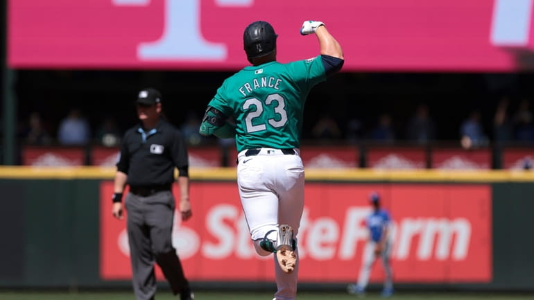 Seattle Mariners' Ty France runs the bases on a solo...
