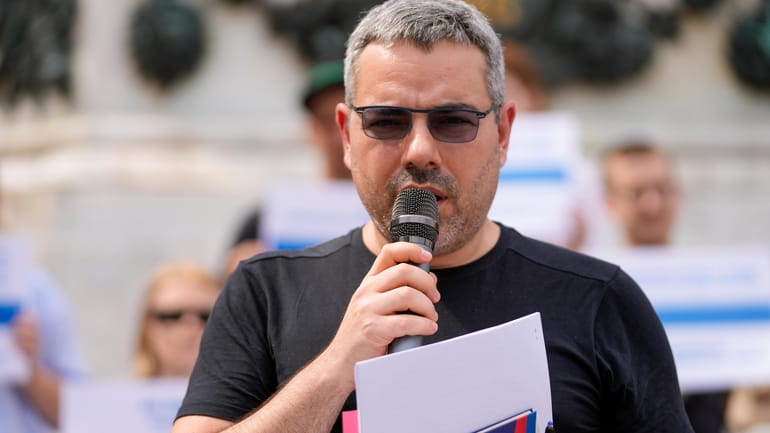 Peter Nikitin, a Russian pro-democracy activist residing in Serbia, speaks...