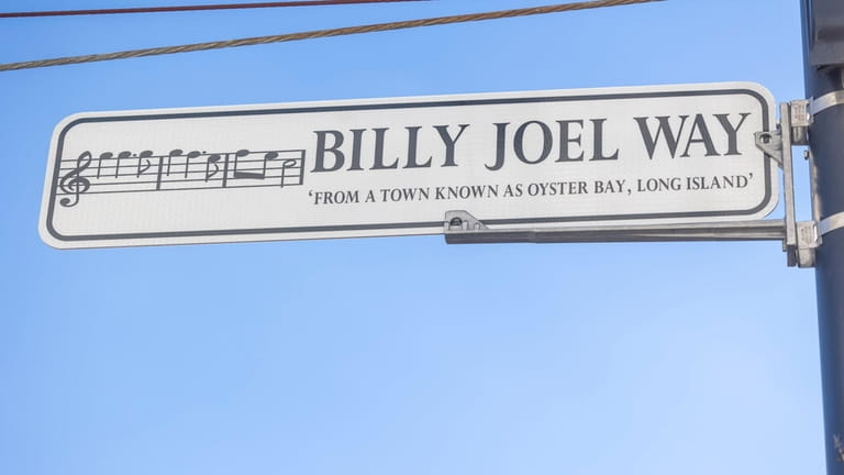 The new Billy Joel Way sign replaces the one for...