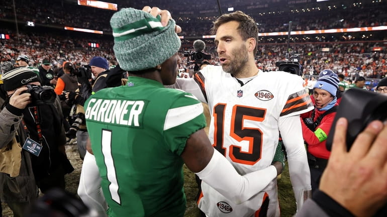 Sauce Gardner of the Jets interacts with Joe Flacco of...