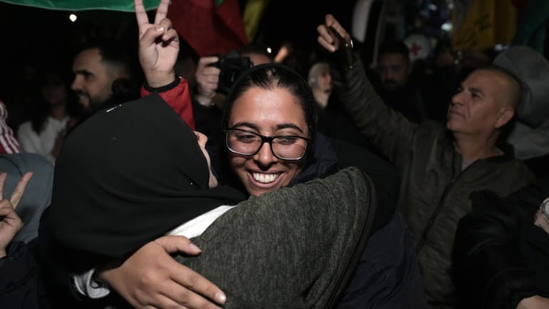 Palestinian prisoner Fairuze Salameh is greeted after she was released,...