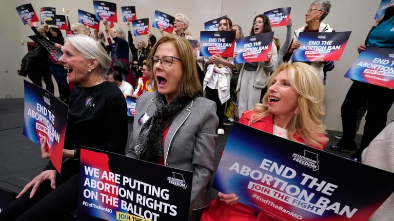 Missouri residents and pro-choice advocates react to a speaker during...