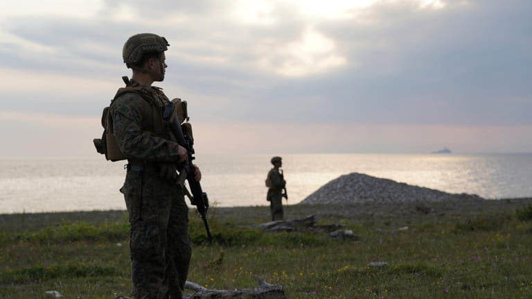 US troops on Gotland beach following amphibious landing drill, part...