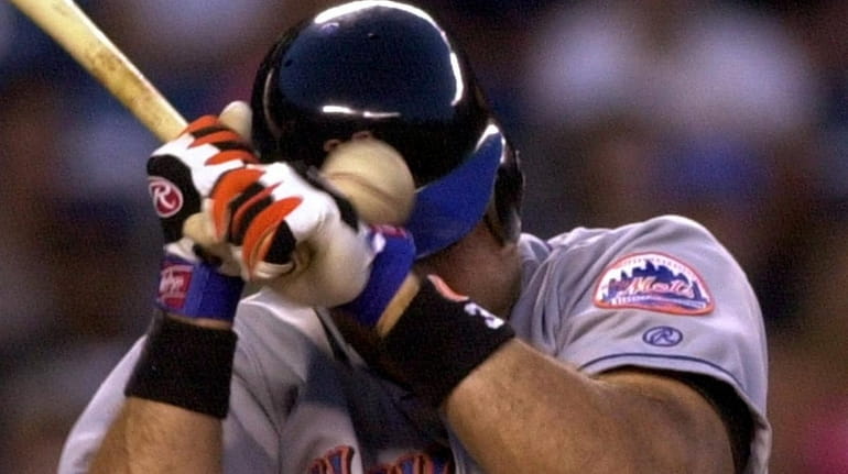 Mike Piazza is hit in the head with a pitch...