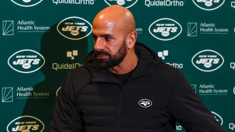 Jets head coach Robert Saleh leaves a news conference after...