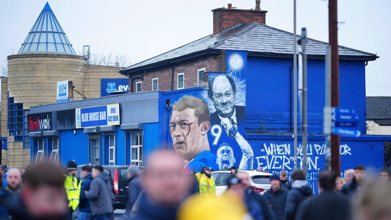 Everton's fans arrive to the Goodison Park stadium before the...