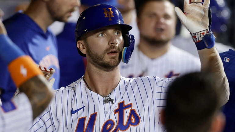 Pete Alonso of the Mets celebrates his fourth-inning two-run home run...