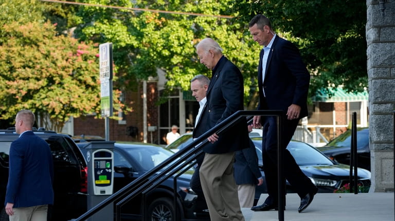 President Joe Biden leaves St. Edmond Roman Catholic Church after...