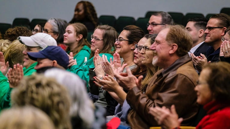 Audience members applaud groups during the Season of Thanks Recognition...