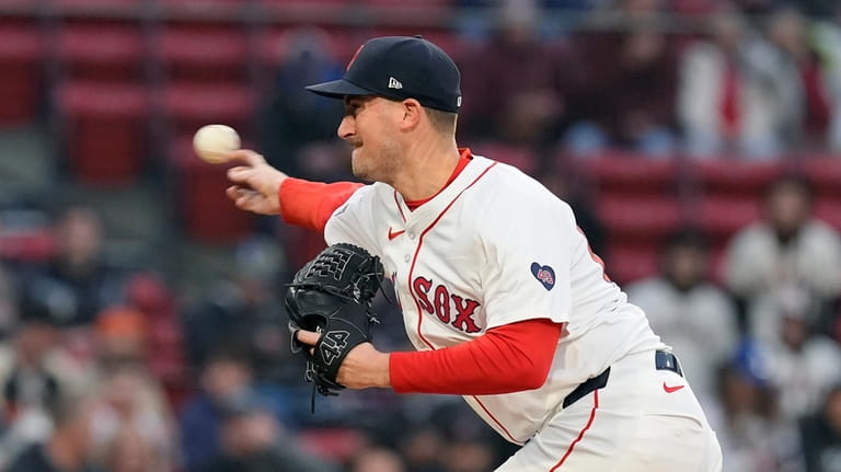 Boston Red Sox starting pitcher Cooper Criswell throws during the...