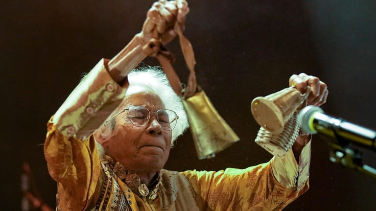 Brazilian singer Catia de Franca, 77, performs using Afro-Brazilian rattles...