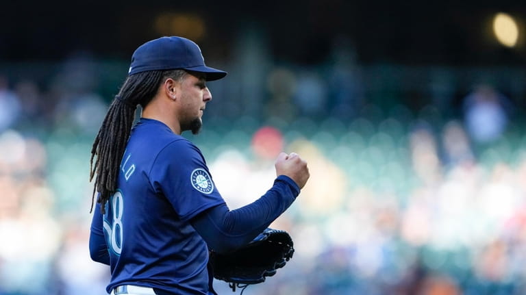 Seattle Mariners starting pitcher Luis Castillo reacts after retiring the...