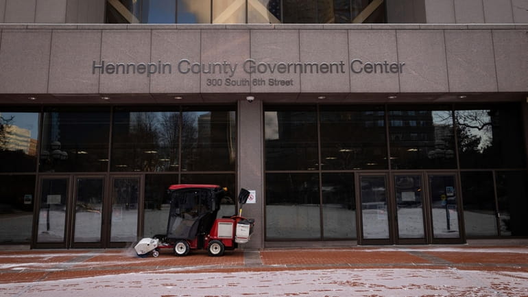 Snow is removed from the entrance of the Hennepin County...