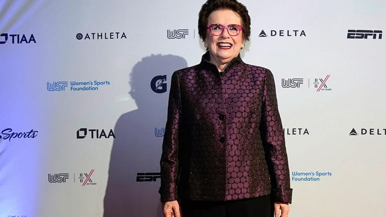 Billie Jean King poses for photos on the red carpet...