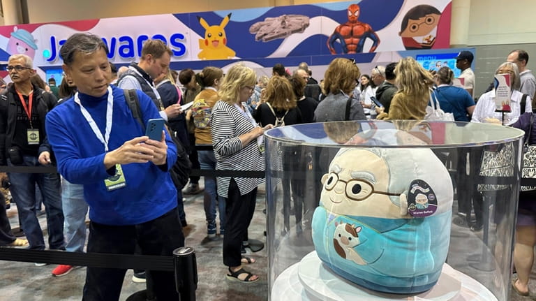 A person takes a photo of the Warren Buffett and...