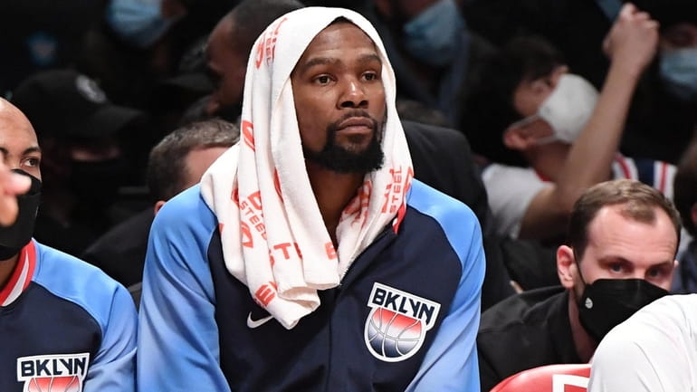 Nets forward Kevin Durant on the bench against the Clippers...