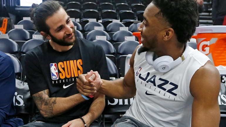 Phoenix Suns guard Ricky Rubio, left, and Utah Jazz guard...