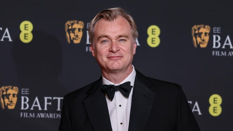 Director Christopher Nolan, winner of the best film and director...