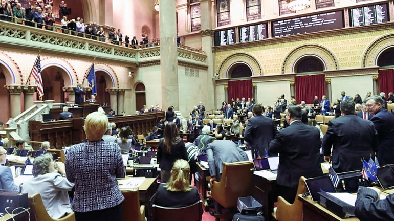 Members of the New York Assembly celebrate after the Child...