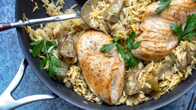 Easy one-pan chicken dinner featuring artichokes.