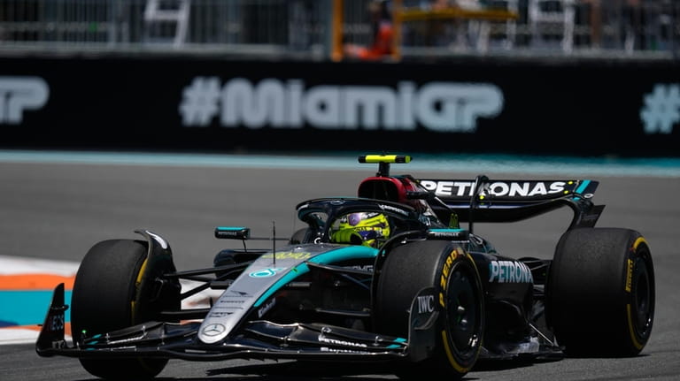 Mercedes driver Lewis Hamilton of Britain steers his car during...