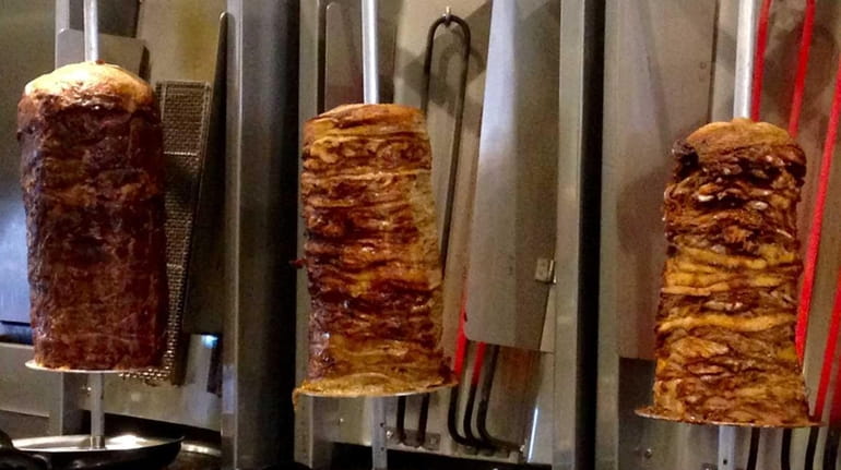 Gyros -- from left, beef-lamb, pork and chicken -- are...