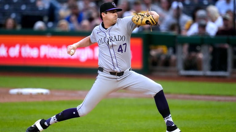 Colorado Rockies starting pitcher Cal Quantrill delivers during the second...