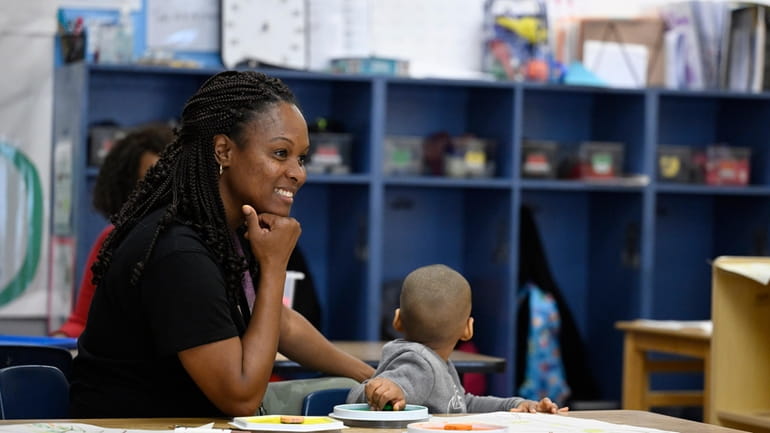 Teacher Vanessa Simmons works with children at a Head Start...