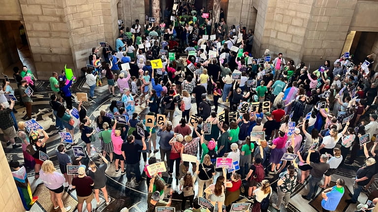 Hundreds of people gather at the Nebraska Capitol to protest...