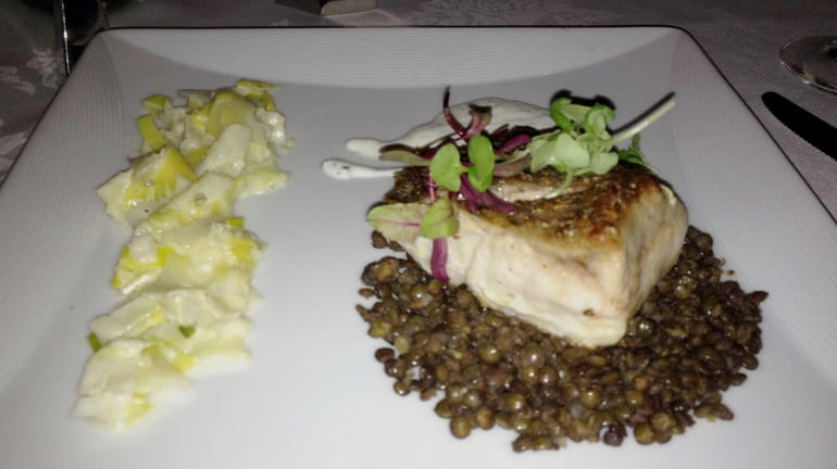 Roasted wild striped bass with French lentils, leeks and cherry...